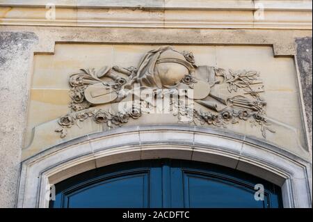 Stone carvings above one of the entrance to the Amelienborg Royal Palace, Copenhagen, Denmark Stock Photo