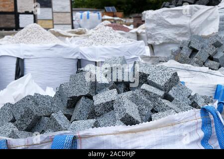 Construction Materials. Building materials for decoration and construction. Gray granite are sold in construction market. Close up. Stock Photo