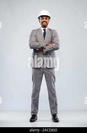 indian male architect in helmet over grey Stock Photo