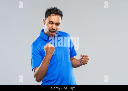 happy indian man celebrating victory Stock Photo