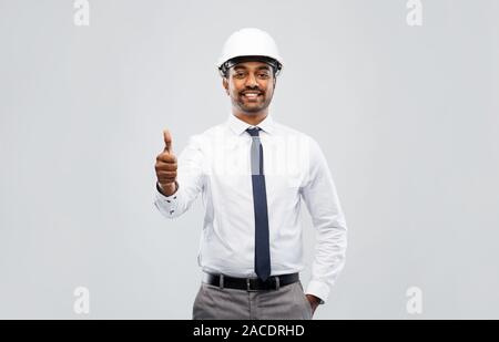 indian male architect in helmet showing thumbs up Stock Photo