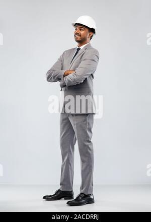 indian male architect in helmet over grey Stock Photo
