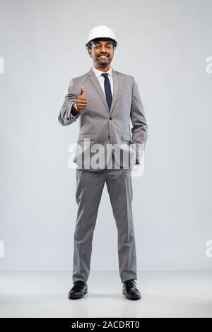 indian male architect in helmet showing thumbs up Stock Photo