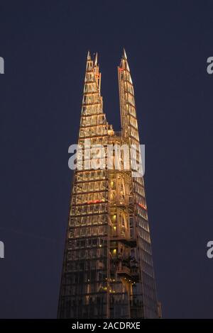 London, UK, 2nd Dec 2019. The top of the Shard glows in the early evening sky. A beautiful sunset with clear skies concludes a cold but sunny day in London. Credit: Imageplotter/Alamy Live News Stock Photo