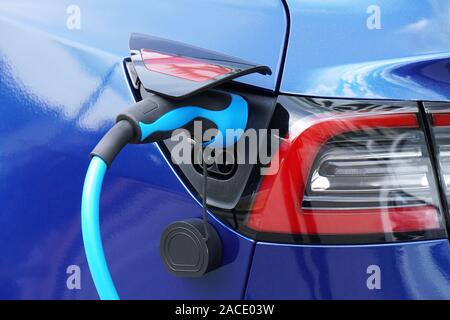 EV or Electric car at charging station with plug-in power supply cable - e-mobility concept Stock Photo