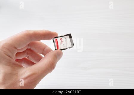High capacity and performance sd memory card in hand close-up Stock Photo