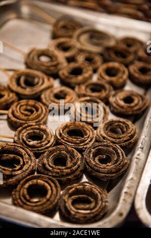 Grilled snakes in a food market in Beijing, China. Stock Photo