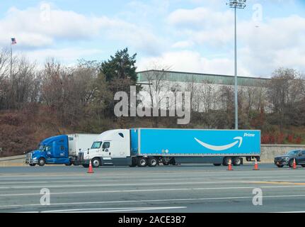 New York November 28 2019: Amazon truck driving on the interstate, the large Prime logo printed on the side - Image Stock Photo