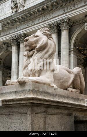 Lion statue in front of the New York Public Library, Manhattan, New York, USA Stock Photo