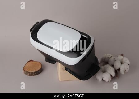 Virtual reality glasses and smartphone on white background. Virtual reality is a computer-generated scenario Stock Photo