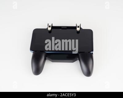 gamepad for smartphones on the white backgrounds. Electronic devices and technology concept Stock Photo