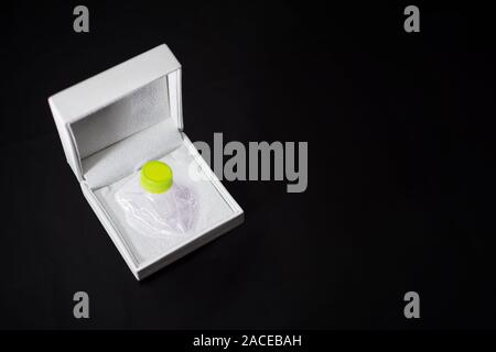 Crushed plastic bottle stored in a jewelry box Stock Photo
