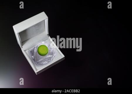 Crushed plastic bottle stored in a jewelry box Stock Photo