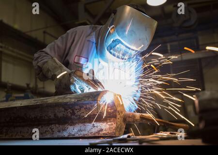 Man welding with sparks flying Stock Photo