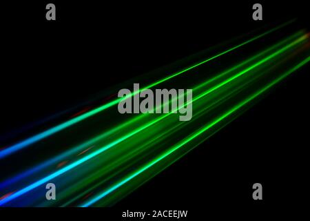 Beams of light refracting and creating a rainbow spectrum of colours against a black background Stock Photo