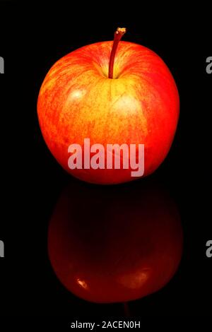 Red eating apple isolated on black glass with a reflection Stock Photo