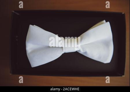 Groom's wedding accessories. Bow tie, suit, cufflinks, belt and shoes Stock Photo