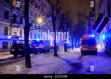 RIGA, LATVIA. 1st December 2019. Emergency rescue services; firefighters and police near building, where member's of  Latvian Parliament Artuss Kaimins appartment was in fire. Stock Photo