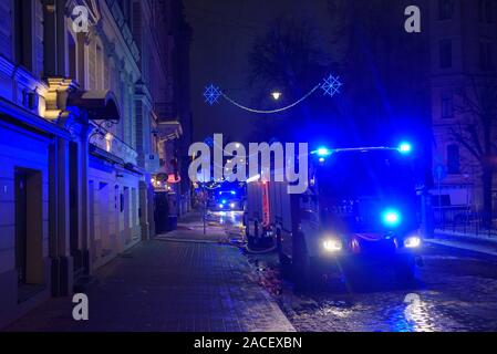 RIGA, LATVIA. 1st December 2019. Emergency rescue services; firefighters and police near building, where member's of  Latvian Parliament Artuss Kaimins appartment was in fire. Stock Photo