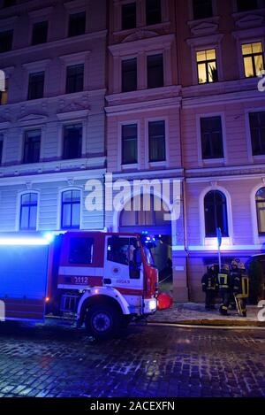 RIGA, LATVIA. 1st December 2019. Emergency rescue services; firefighters and police near building, where member's of  Latvian Parliament Artuss Kaimins appartment was in fire. Stock Photo