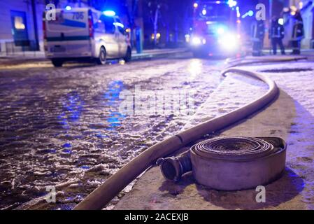 RIGA, LATVIA. 1st December 2019. Firse hose on the ground. Emergency rescue services; firefighters and police near building, where member's of  Latvian Parliament Artuss Kaimins appartment was in fire. Stock Photo