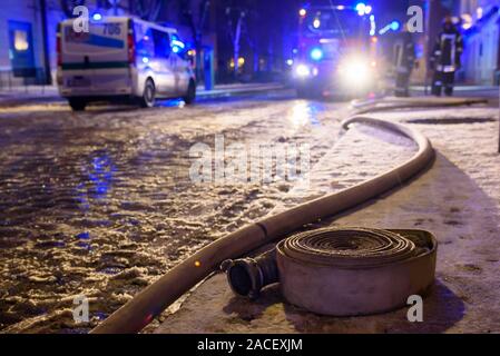 RIGA, LATVIA. 1st December 2019. Firse hose on the ground. Emergency rescue services; firefighters and police near building, where member's of  Latvian Parliament Artuss Kaimins appartment was in fire. Stock Photo