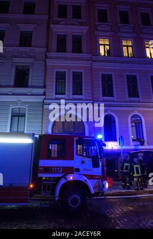 RIGA, LATVIA. 1st December 2019. Emergency rescue services; firefighters and police near building, where member's of  Latvian Parliament Artuss Kaimins appartment was in fire. Stock Photo