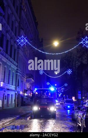 RIGA, LATVIA. 1st December 2019. Emergency rescue services; firefighters and police near building, where member's of  Latvian Parliament Artuss Kaimins appartment was in fire. Stock Photo