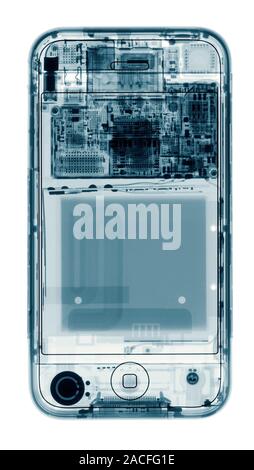 Mobile phone. Coloured X-ray of a mobile phone, showing its internal structure. Stock Photo