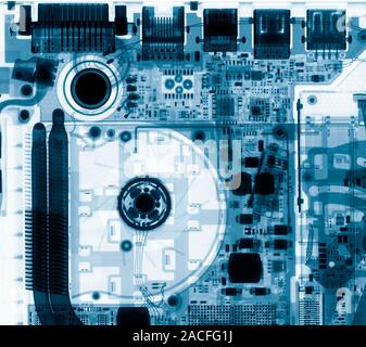 Laptop ports. Coloured X-ray of port sockets (top) at the back of a laptop, showing their internal structure. From top left to top right are: a dual-l Stock Photo
