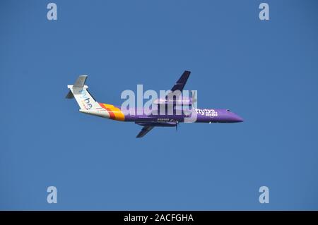Flybe plane taking off from London City airport against a clear blue sky Stock Photo