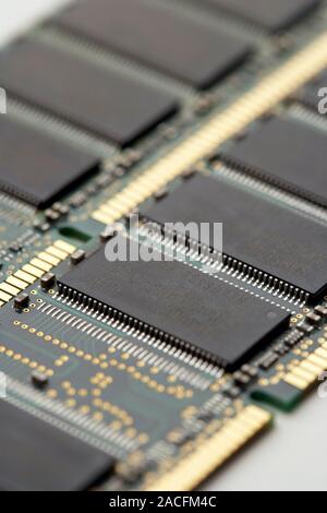 Computer memory chips. RAM (random access memory) chips (grey) on two circuit boards from a computer. Stock Photo