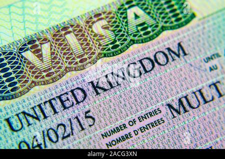 UK entry visa type C (Business, Tourism) sticker in a passport. Macro photo. Stock Photo
