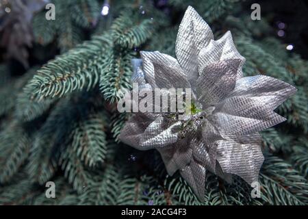 silver decorative flower on the Christmas tree Stock Photo