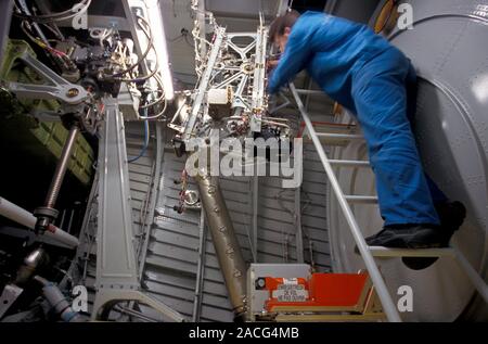 Passenger aircraft construction. Technician working on the emergency operating instruments of the tail fin of an Airbus passenger aircraft during its Stock Photo