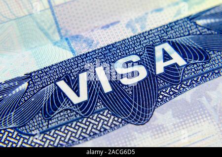 Macro photo of US Visa sticker in a passport. The B1/B2 visa allows you to enter the United States of America for business / pleasure, tourism. Stock Photo