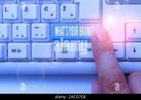 Writing note showing What S Your Brand Question. Business concept for asking about product logo does or what you communicate White pc keyboard with no Stock Photo