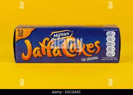 A box of McVities Jaffa Cakes shot on a yellow background. Stock Photo