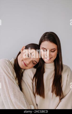 Portrait of two smiling sisters Stock Photo