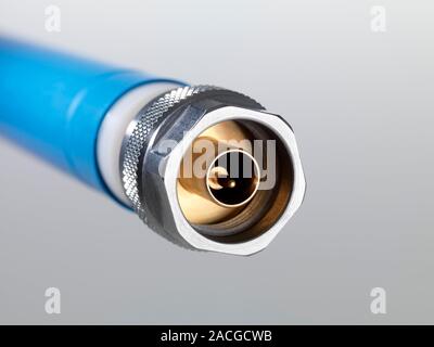 Coaxial connector connection point. This electrical device is used for the transmission of high-frequency (broadband) electrical signals. This is an A Stock Photo
