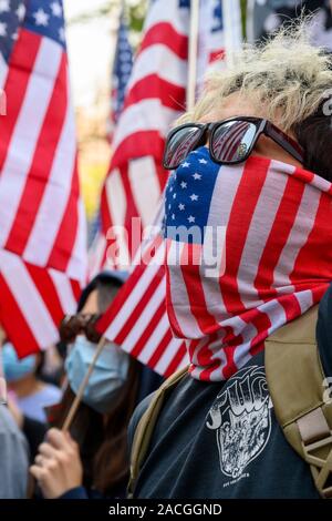 Central Hong Kong. December 1, 2019. Hundreds of protesters gathered in Chater Garden and marched to the US Consulate in Hong Kong for a peaceful demonstration. The gathering was to thank the United States for passing the Hong Kong Human rights and Democracy Act 2019. This act would sanction officials who undermined people's rights in the Hong Kong SAR. Stock Photo