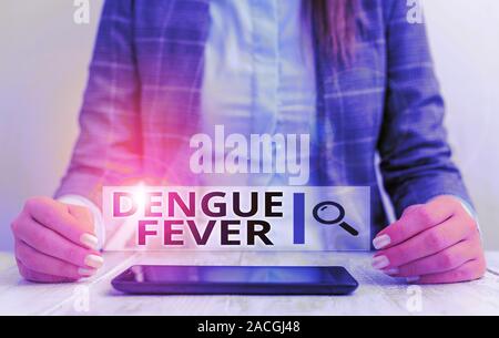 Handwriting text writing Dengue Fever. Conceptual photo infectious disease caused by a flavivirus or aedes mosquitoes Business woman sitting with mobi Stock Photo