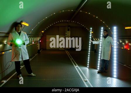 LED street lighting. Technicians from the company Elettronica Gelbison checking light emitting diode (LED) arrays in a tunnel. This company installed Stock Photo