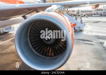 Jet engine nacelle on Easyjet aircraft with passengers boarding, Bristol airport, England, UK Stock Photo