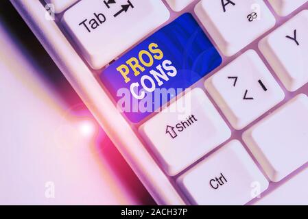 Conceptual hand writing showing Pros Cons. Concept meaning The favorable and unfavorable factors or reasons of demonstrating White pc keyboard with no Stock Photo