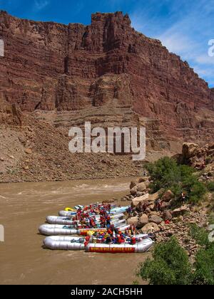 33' S-rig rafts on the shore of Cataract Canyon on the Colorado River in Canyonlands National Park in Utah. Stock Photo