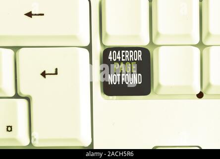 Conceptual hand writing showing 404 Error Page Not Found. Concept meaning Webpage on Server has been Removed or Moved White pc keyboard with note pape Stock Photo