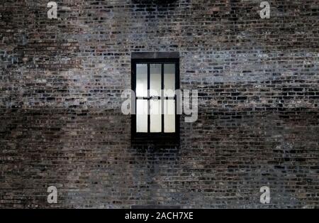 single window encased in brick Stock Photo