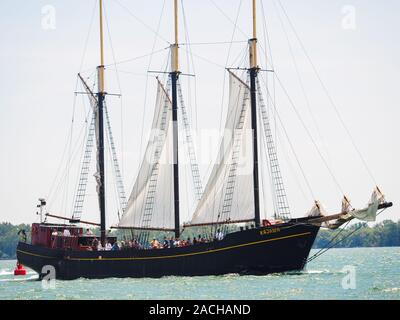 Three-masted tall ship Kajama schooner sailing on Lake Ontario, carrying passengers. Stock Photo