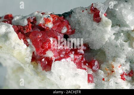 Realgar in dolomite. Realgar is an orange-red, arsenic sulphide mineral, from which a large proportion of the world's arsenic is derived. Realgar is h Stock Photo
